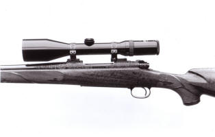 Merlin Smart Stockmaker Winchester Model 70 engraved in large scroll by Barry Lee Hands copyright 2008